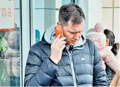  ?? ?? The official, below, told Ukrainian refugees in Rzeszow that he could not let them in to the city’s temporary UK visa office. He conceded: ‘It’s not acceptable, it’s not good enough’