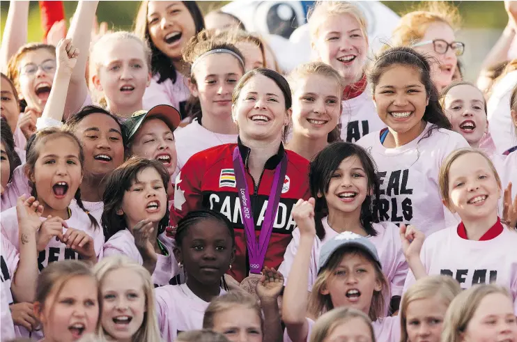  ?? — POSTMEDIA NEWS FILES ?? Young female soccer players take a giant selfie with Team Canada’s Diana Matheson at an NASL game at Clarke Stadium last Saturday.