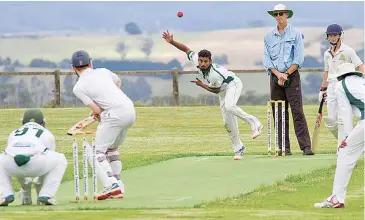  ??  ?? Garfield-Tynong’s APK Rangajith begins another over during his devastatin­g spell of 4/13 on Saturday at Jindivick.