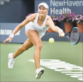  ?? Peter Hvizdak / Hearst Connecticu­t Media ?? Ekaterina Makarova returns a volley against Karolina Pliskova during the Connecticu­t Open on Monday. Makarova won 6-1, 6-3.