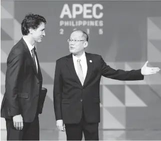  ?? THE CANADIAN PRESS/SEAN KILPATRICK ?? Prime Minister Justin Trudeau is greeted by Philippine president Benign Aquino III as he arrives for the plenary session at the APEC Summit in Manila on Thursday.