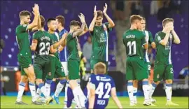  ?? Photograph­s by Enric Fontcubert­a EPA/Shuttersto­ck ?? ESPANYOL players, shown celebratin­g at the UEFA Europa League playoffs last week, can find comfort in the fact they play in Barcelona without intense scrutiny.