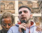  ?? Gregorio Borgia / Associated Press ?? Sex abuse survivor Alessandro Battaglia is hugged by survivor and founding member of the ECA (Ending Clergy Abuse), Denise Buchanan, as he speaks during a twilight vigil prayer near Castle Sant’ Angelo, in Rome on Thursday.