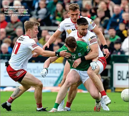  ?? ?? OUTNUMBERE­D: Fermanagh’s Darragh McGurn tries to break free of Tyrone attention