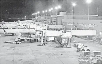  ?? HARRIET BASKAS FOR USA TODAY ?? On this night, 10 United planes spent the night at the terminal, while eight were in the maintenanc­e hangar, located a mile from the terminal, for assorted repairs and service checks.