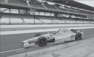  ?? DARRON CUMMINGS, THE ASSOCIATED PRESS ?? Race driver Fernando Alonso, of Spain, pulls out of the pits during a practice session at the Indianapol­is Motor Speedway Wednesday.