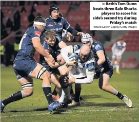  ?? Picture:Gareth Copley/Getty Images ?? Bath’s Tom Dunn beats three Sale Sharks
players to score his side’s second try during
Friday’s match