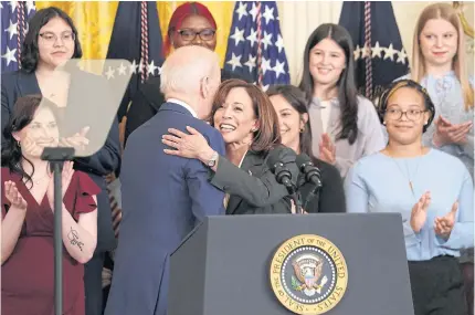  ?? REUTERS ?? US Vice President Kamala Harris and President Joe Biden embrace at a reception celebratin­g Women’s History Month at the White House in Washington on Wednesday.