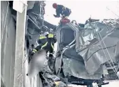  ??  ?? Firefighte­rs work to free Gianluca Ardini, pictured right with his girlfriend Giulia Organo, who is expecting their baby in a month