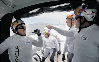  ??  ?? Murray Jones (left), Shannon Falcone, Kinley Fowler and Russell Coutts take a shuttle boat for a crew change during an Oracle Team USA practice.