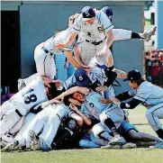  ?? [PHOTO BY STEVE SISNEY, THE OKLAHOMAN] ?? Players pile on the pitcher as Shawnee defeats Claremore in the Class 5A high school state championsh­ip baseball final at Yukon High School.