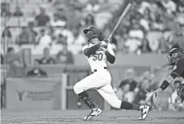  ?? ?? The Dodgers’ Mookie Betts hits a home run against the Miami Marlins during the first inning of Friday’s game at Dodger Stadium in Los Angeles.