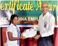  ??  ?? Chairman of Give2Lanka and former Chairman Berendina, Dulan de Silva, handing over certificat­e of merit to P. Kumuthini of N/ Cambridge College, Kottagala.