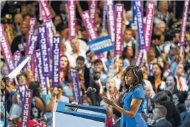  ?? STEPHEN CROWLEY/THE NEW YORK TIMES ?? First lady Michelle Obama speaks Monday on the first day of the Democratic National Convention in Philadelph­ia.