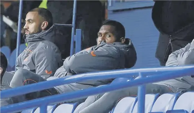  ??  ?? 0 Colombian striker Alfredo Morelos looks on from the bench as Rangers beat Livingston 2-0 at Ibrox on Sunday. He is set to return to the starting line-up tonight