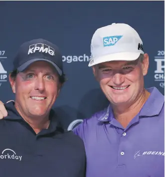  ?? WARREN LITTLE/GETTY IMAGES ?? Phil Mickelson and Ernie Els celebrate playing in their 100th major tournament before the 2017 PGA Championsh­ip on Tuesday in Charlotte, N.C.