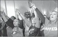  ?? AP/Charleston Gazette-Mail/CRAIG HUDSON ?? Teachers and school personnel celebrate Tuesday at the West Virginia Capitol after lawmakers approved pay raises for them.