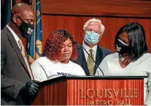  ?? AP ?? Tamika Palmer, mother of Breonna Taylor, centre, speaks during a news conference in Louisville. Beside Palmer is attorney Ben Crump, left, and attorney Lonita Baker, right.