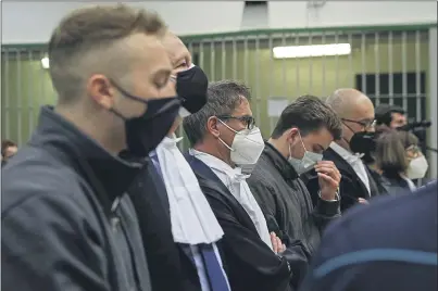  ?? GREGORIO BORGIA — AP PHOTO ?? Finnegan Lee Elder, left, and Gabriel Natale-Hjorth, fourth from left, listen as the verdict is read, finding them guilty of the slaying of an Italian plaincloth­es police officer in Rome in 2019.