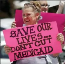  ?? ASSOCIATED PRESS ?? Protesters block a street in Salt Lake City, Utah, during a protest this week against the Republican bill in the U.S. Senate to replace President Barack Obama’s health care law.