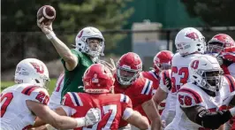  ?? PHOTOS CONTRIBUTE­D BY JEFF GILBERT ?? Dayton quarterbac­k Drew Van Vleet throws from the pocket during Sunday’s annual spring game. He is expected to be the Flyers’ starter.