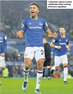  ??  ?? > Dominic Calvert-Lewin celebrates after scoring Everton’s equaliser