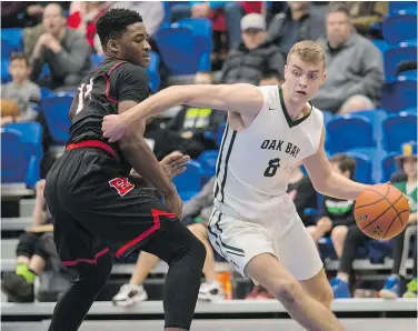  ?? DARREN STONE/TIMES COLONIST FILES ?? Oak Bay dropped a 95-84 decision to Edmonton’s Harry Ainlay on Friday. The coach says, ‘we need to get healthy and mentally sharp.’