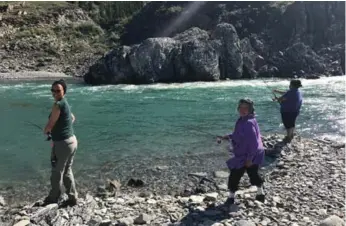  ?? JENNIFER BAIN/TORONTO STAR ?? Rachel Hansen, Renie Arey and base camp cook Nellie C. Elanik fish in the mighty Firth River.