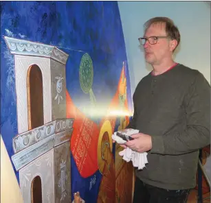  ?? Photos by Joseph B. Nadeau ?? Above: Artist Michael Kapeluck works on one of the new murals at St. Michael.