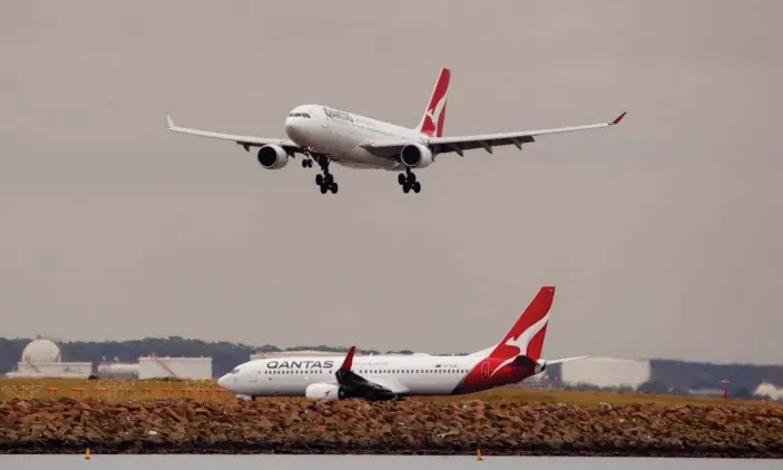  ?? Photograph: Daniel Munoz/Reuters ?? Qantas was hoping internatio­nal travel could begin by October but Scott Morrison says ‘the issues of borders and how they are managed will be done very, very carefully’.