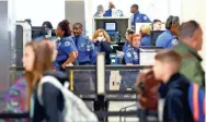  ?? JOE RONDONE/THE COMMERCIAL APPEAL ?? Travelers make their way through Memphis Internatio­nal Airport on Monday, March 16, 2020. Airport officials say that travel is down around 50 percent nationwide from this time last year, likely due to concerns over the spread of coronaviru­s.