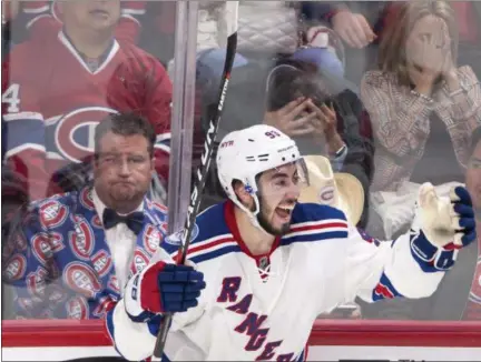  ?? PHOTOS BY RYAN REMIORZ — THE CANADIAN PRESS VIA AP ?? Rangers’ Mika Zibanejad celebrates after scoring the game-winning goal in overtime against the Canadiens during Game 5 of a first-round playoff seriess.