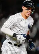  ?? Frank Franklin II / Associated Press ?? New York’s Aaron Judge reacts after hitting a three-run home run during the ninth inning, the first walk-off homer of his MLB career.