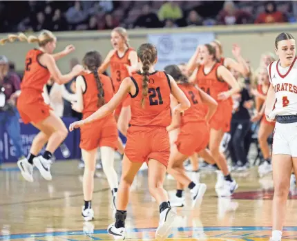  ?? PHOTOS BY SARAH PHIPPS/THE OKLAHOMAN ?? Dale’s Ava Bell (4) reacts as Merritt celebrates the Class 2A state championsh­ip at the State Fair Arena on Saturday in Oklahoma City.