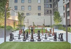  ??  ?? Each of the three Deluxe Garden Suites includes a sprawling outdoor area, featuring a giant chess board and individual patios.