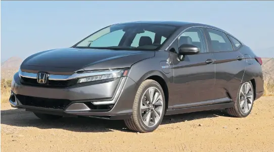  ?? PHOTOS: GRAEME FLETCHER/DRIVING ?? New for 2018, the Honda Clarity plug-in hybrid is the epitome of the new wave in electric hybrid vehicles — easy on the eyes and the wallet.