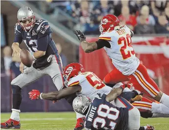  ?? STAFF PHOTO BY mATT STOne ?? UNDER PRESSURE: Chiefs linebacker Justin Houston and safety Eric Berry put the heat on Tom Brady during the Pats’ opening-night loss.