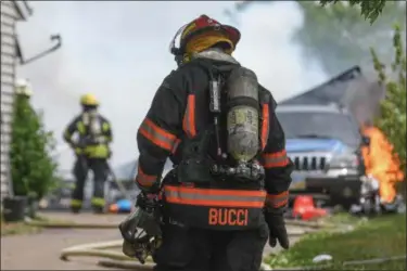  ?? ERIC BONZAR — THE MORNING JOURNAL ?? Lorain firefighte­rs battle a detached garage fire at a home in the 1500 block of Fillmore Avenue on July 6, 2016.