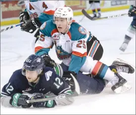  ?? Daily Courier file photo ?? Kelowna Rocket Cal Foote knocks down Seattle Thunderbir­d Ryan Gropp during a WHL game at Prospera Place on Feb. 13. Foote will miss tonight’s opening game of the Western Conference final series as he sits out the final game of a three-game suspension.