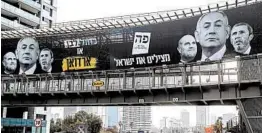  ?? MENAHEM KAHANA/GETTY-AFP ?? Images of Israeli Prime Minister Benjamin Netanyahu, center, Justice Minister Amir Ohana, left, and Education Minister Rafi Peretz are seen on a billboard Sunday.