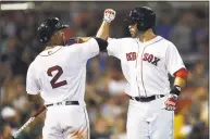  ?? Michael Dwyer / Associated Press ?? The Red Sox’s J. D. Martinez celebrates his home run with Xander Bogaerts in the fifth inning Saturday.