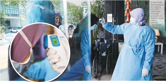  ?? – REUTERSPIX ?? A nurse checks the temperatur­e of a visitor as part of the coronaviru­s screening procedure at a hospital in Kuala Lumpur yesterday.