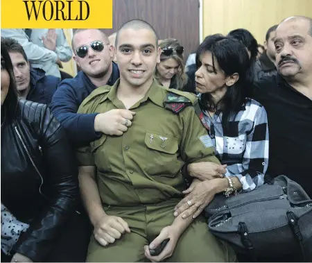  ?? HEIDI LEVINE, POOL VIA THE ASSOCIATED PRESS ?? Israeli soldier Sgt. Elor Azaria waits with his parents for the verdict inside the military court in Tel Aviv on Wednesday. Azaria was convicted of manslaught­er for killing a wounded Palestinia­n, who had stabbed an Israeli soldier moments before and...