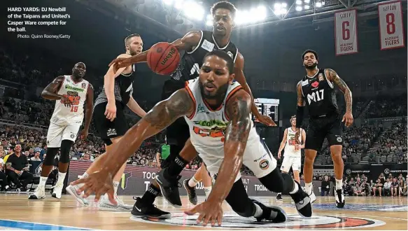  ?? Photo: Quinn Rooney/Getty ?? HARD YARDS: DJ Newbill of the Taipans and United’s Casper Ware compete for the ball.