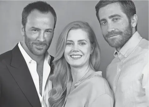  ?? TOM FORD, AMY ADAMS AND JAKE GYLLENHAAL BY ROBERT HANASHIRO, USA TODAY ??