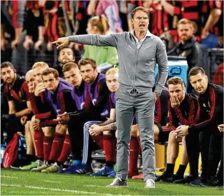  ?? CURTIS COMPTON / CCOMPTON@AJC.COM ?? Atlanta United manager Frank de Boer coaches during Thursday night’s 4-0 victory over C.S. Herediano in their CONCACAF Champions League match in Kennesaw. United begins defense of its MLS title tonight at D.C. United.