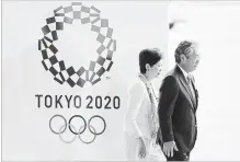  ?? ASSOCIATED PRESS FILE PHOTO ?? Tokyo Gov. Yuriko Koike, left, and Tsunekazu Takeda, president of the Japanese Olympic Committee, face a cost exceeding $30 billion.