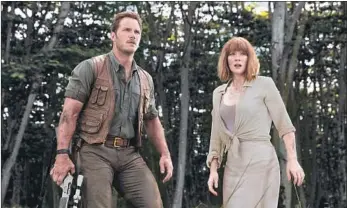  ?? Chuck Zlotnick Universal Pictures ?? Jurassic Park III,” above, right, handed off duties to Chris Pratt and Bryce Dallas Howard with 2015’s film.