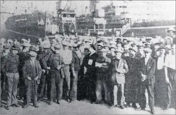  ??  ?? BROTHERS IN ARMS: Striking crew members gathered in their hundreds on the quayside in Durban harbour on August 28, 1925.