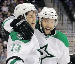  ?? JOE MAHONEY/THE ASSOCIATED PRESS ?? The Stars’ Jason Demers, right, congratula­tes centre Mattias Janmark after Janmark scored against the Colorado Avalanche in the first period Saturday.